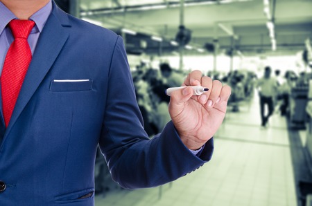 business man use pen writing on virtual screenの写真素材