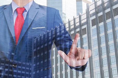 business man hand touching virtual screenの写真素材