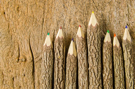 wooden pencils on wood backgroundの写真素材