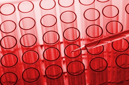 science laboratory test tubes in red tone