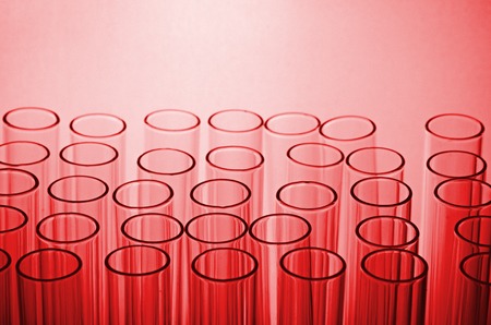 science laboratory test tubes in red toneの写真素材