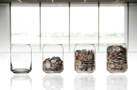 saving glass jar on open windows backgroundの写真素材