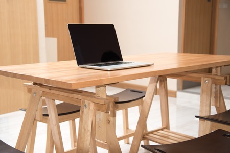 laptop on wood desk , working placeの写真素材