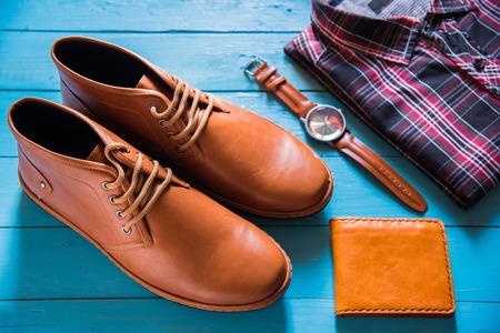 Flat lay of men casual fashion on wooden floor