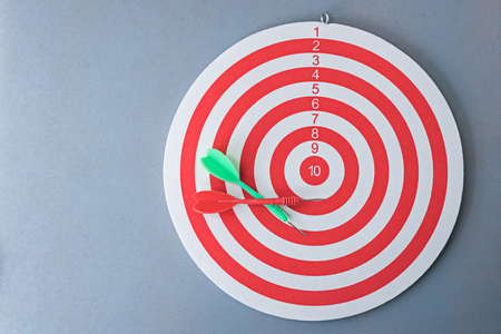red and green darts on dartboardの写真素材