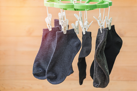 many socks drying on clotheslineの写真素材