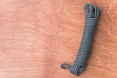 Green rope on wood backgroundの写真素材