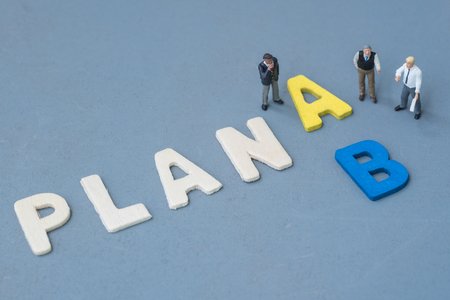 business miniature talking about select the plan A or Bの写真素材