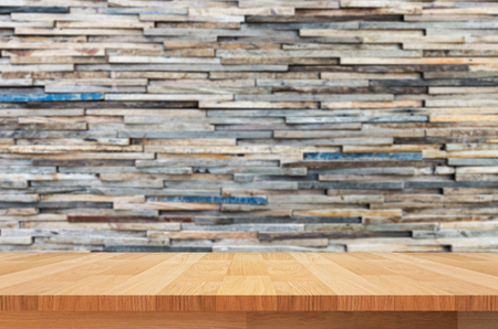 wood shelf on modern stone wall backgroundの写真素材