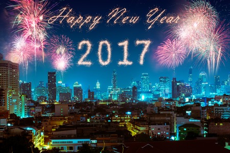 fireworks over night city for happy new year 2017 celebration