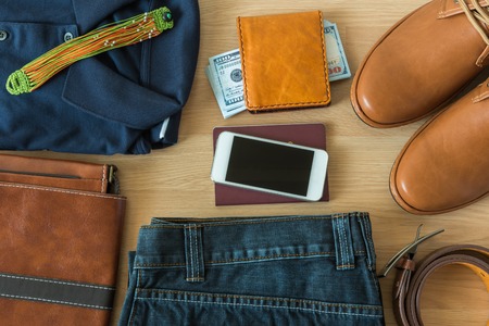 Flat lay of men's casual fashion on white wooden floorの写真素材