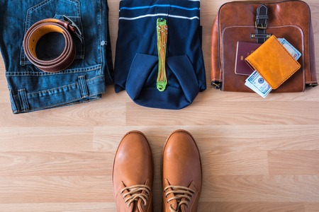 Flat lay of men's casual fashion on white wooden floorの写真素材