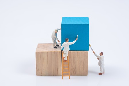 miniature people worker painting wood cube building blockの写真素材