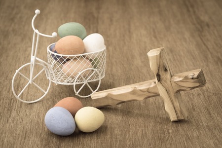 easter eggs decorated in white miniature bicycleの写真素材