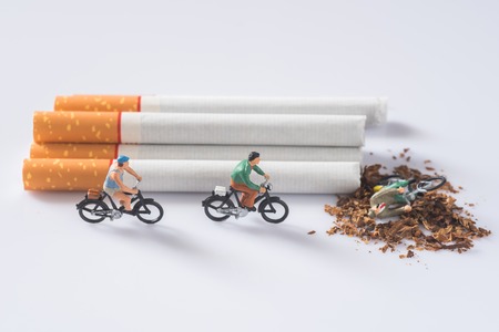 people riding a bike on cigarette background