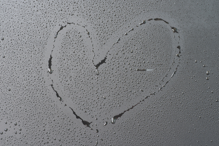 heart shape on water drops with black backgroundの写真素材