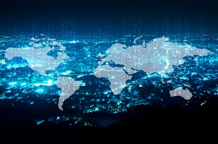 digital technology and world map  over night city backgroundの写真素材