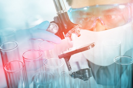 Double exposure of scientist and laboratory test tube , science research conceptの写真素材