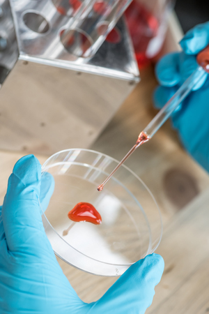 scientist or doctor dropping a blood into blood test tube, research  conceptの写真素材