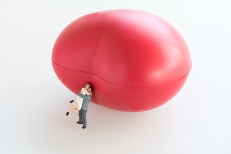 couple lover with big red heart on white backgroundの写真素材