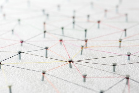 abstract web line connection of color yarn from nail node to node on white background , networking concept.の写真素材