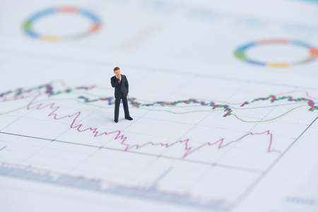 business miniature people on business graphの写真素材