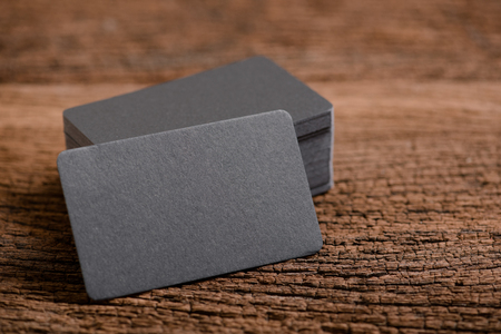 black blank business name card for mock up on wood background.の写真素材