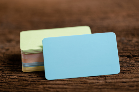 blue blank business name card for mock up on wood background.の写真素材