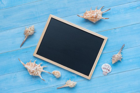 black board on light blue wood plank floor backgroundの写真素材