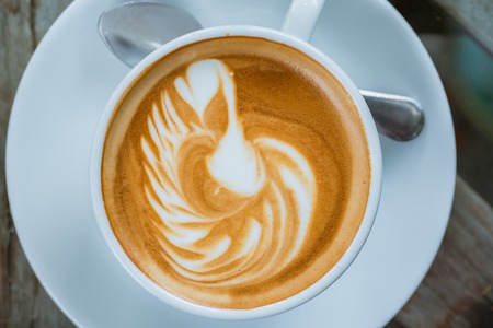 white coffee cup on the tableの写真素材