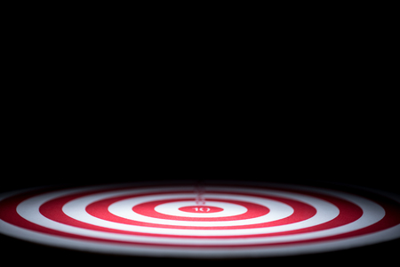 abstract dartboard on dark background lighted with snootの写真素材