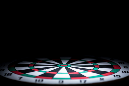 abstract dartboard on dark background lighted with snootの写真素材