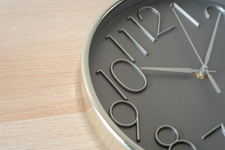 clock on wood table , closed up