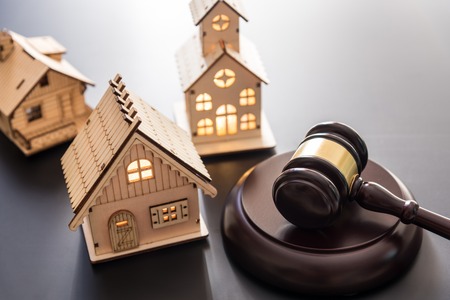 gavel justice hammer and wood house on  black  backgroundの写真素材