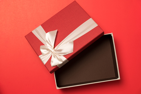 open red gift box on red background for happy new yearの写真素材