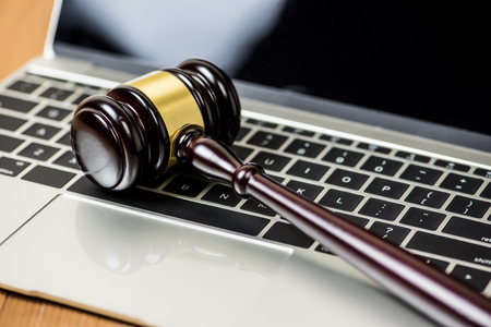 gavel justice hammer on computer laptop , online auction conceptの写真素材
