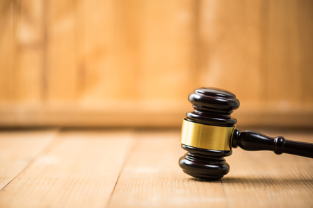 gavel justice hammer on  wood backgroundの写真素材