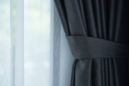bundle gray black curtain on white curtain backgroundの写真素材