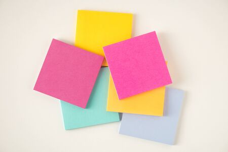 many colorful sticky notes on white board background.