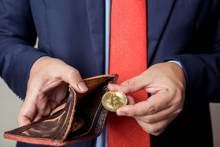 businessman showing bitcoin digital currency in pocket, bitcoin wallet concept