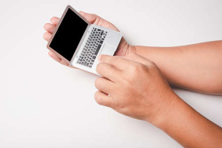 man hand using digital pressure gauge check his blood pressure , digital number showing hypertension...