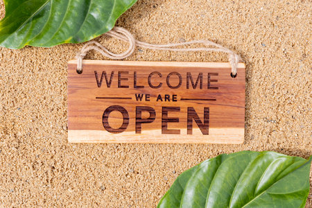 open sign board on sandの写真素材