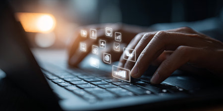Hands Typing on Laptop with Floating Icons Representing Artificial Intelligence, Data Analysis, and Business Strategy Concepts in Modern Workspaceの素材