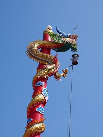 Dragon on the pole of shrineの写真素材
