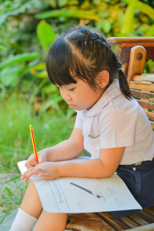 Children were doing homework in the evening の写真素材