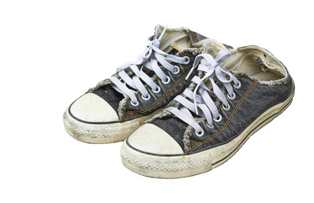 Old black sneakers isolated の写真素材