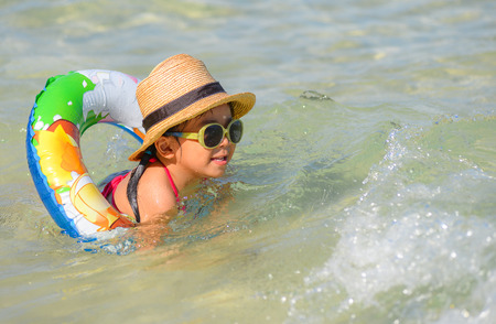 Cute Asian girl enjoy a swim の写真素材