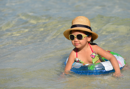 Cute Asian girl enjoy a swim の写真素材