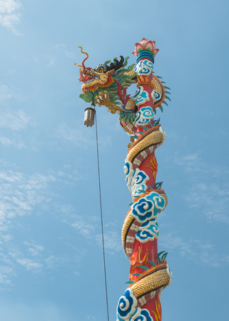 dragon statue on blue skyの写真素材