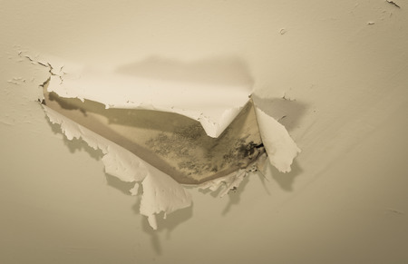 cracked paint on wall background using aged filterの写真素材